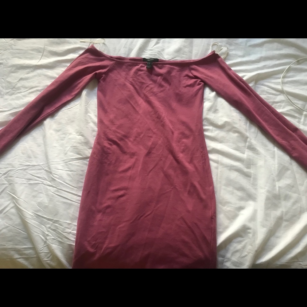 An off the shoulder tight fitted dress